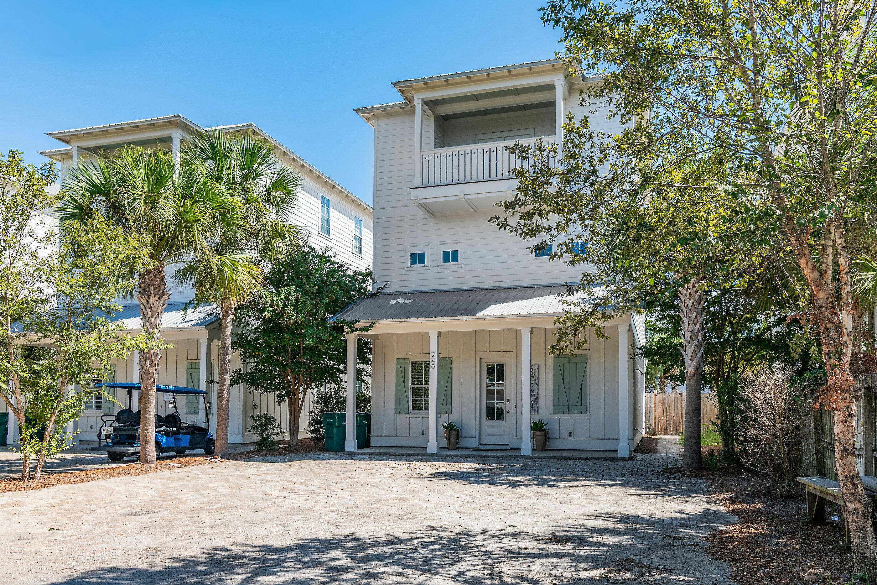 240 Driftwood Road Miramar Beach, FL 32550 - Photo 6 of 65 a front view of a building with a garden