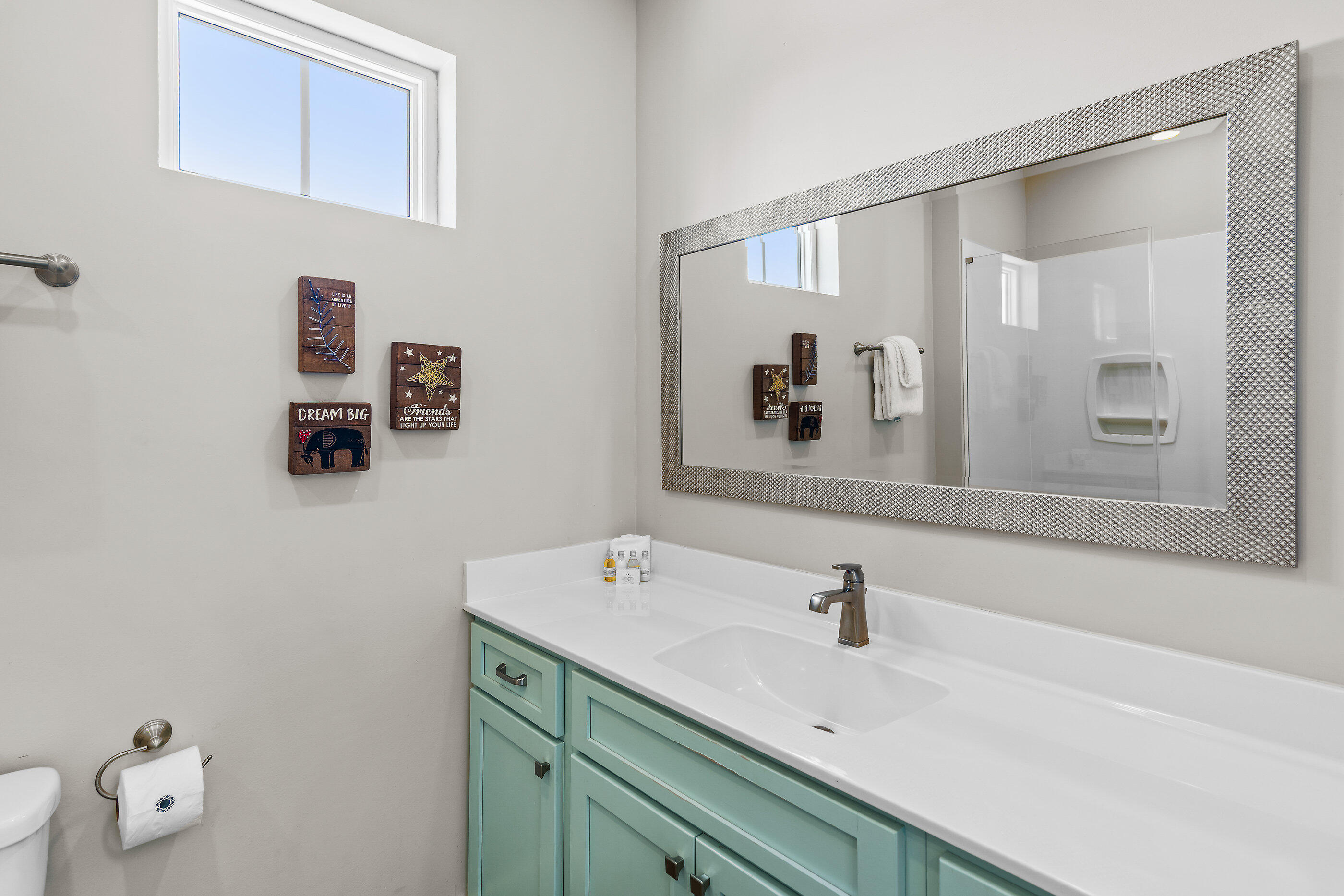 240 Driftwood Road Miramar Beach, FL 32550 - Photo 61 of 65 a bathroom with a sink and a mirror