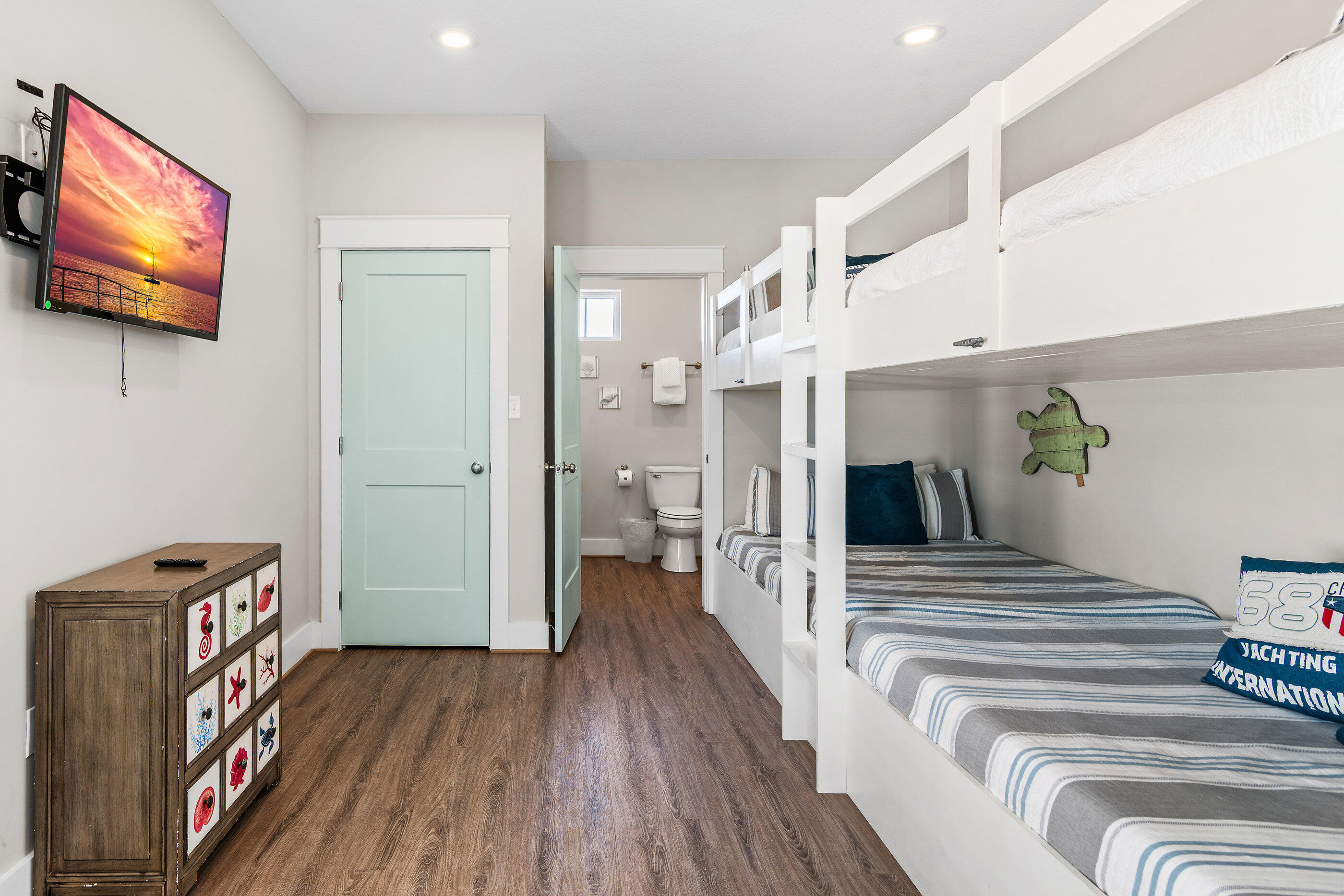 240 Driftwood Road Miramar Beach, FL 32550 - Photo 62 of 65 a bedroom with furniture and a flat screen tv