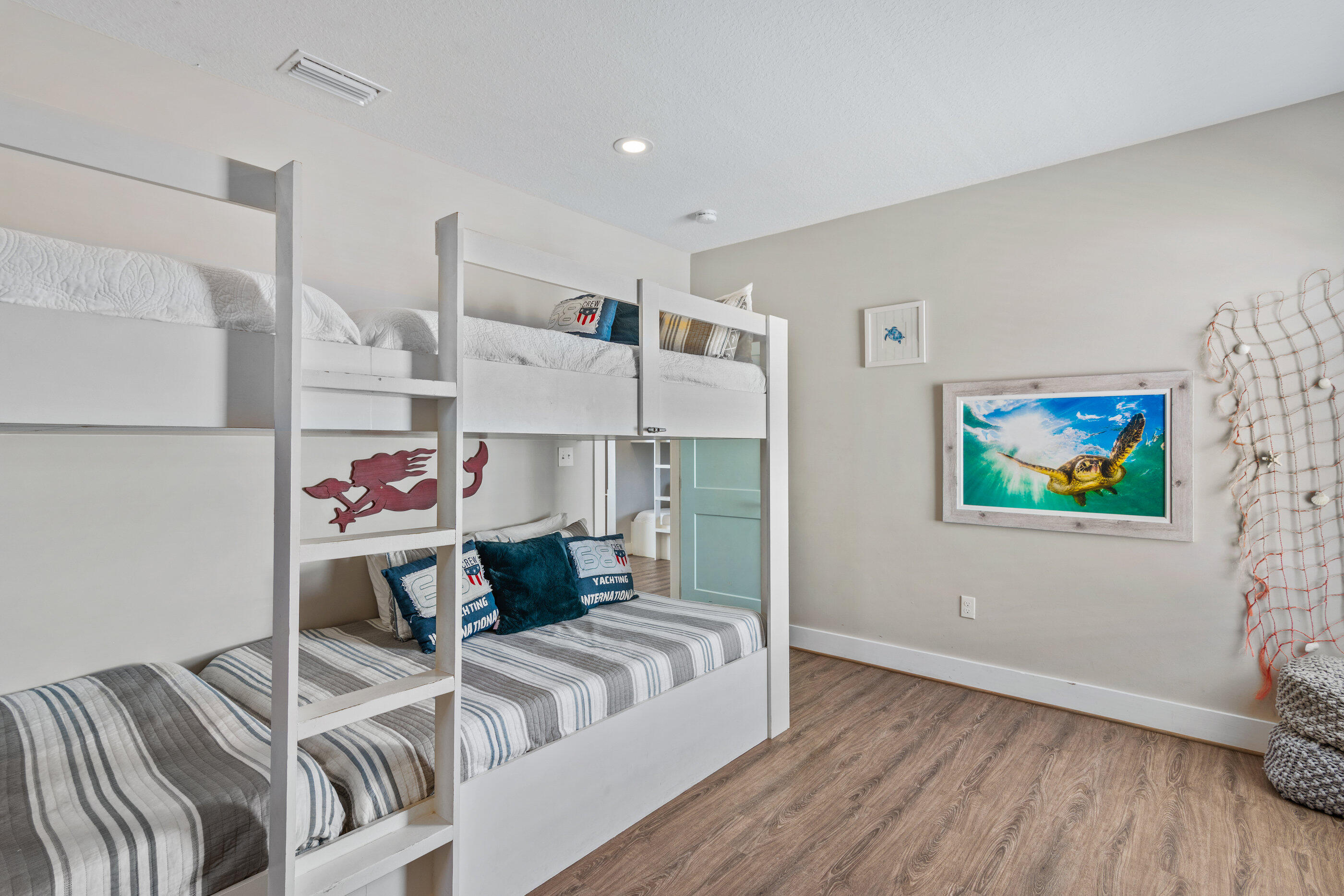 240 Driftwood Road Miramar Beach, FL 32550 - Photo 64 of 65 a living room with furniture and a flat screen tv