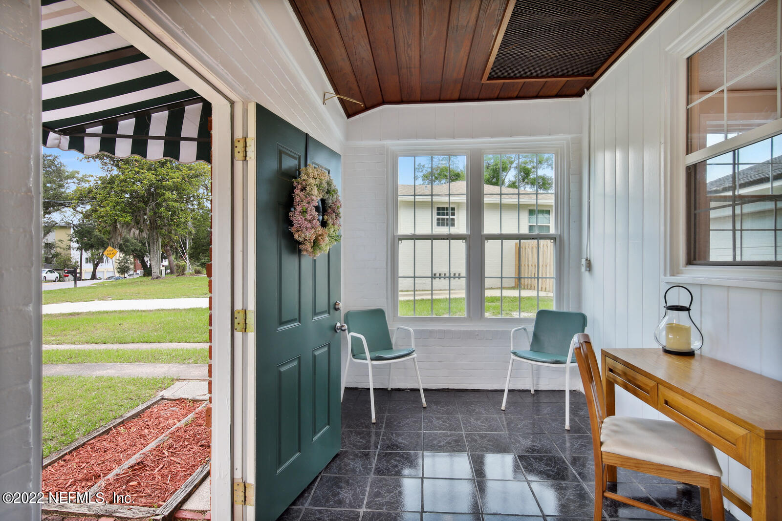 1639 Mayfair Road Jacksonville, FL 32207 - Photo 5 of 26 a living room with a window and a table