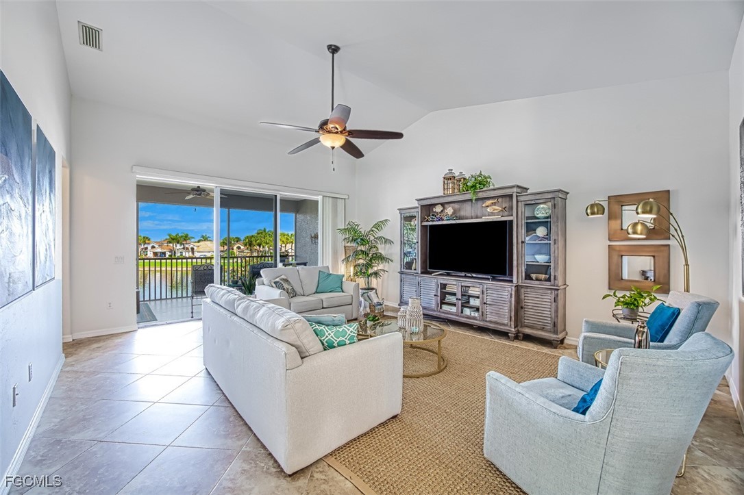 9570 Hemingway Lane, Unit 3205 Fort Myers, FL 33913 - Photo 14 of 43 a living room with furniture and a flat screen tv