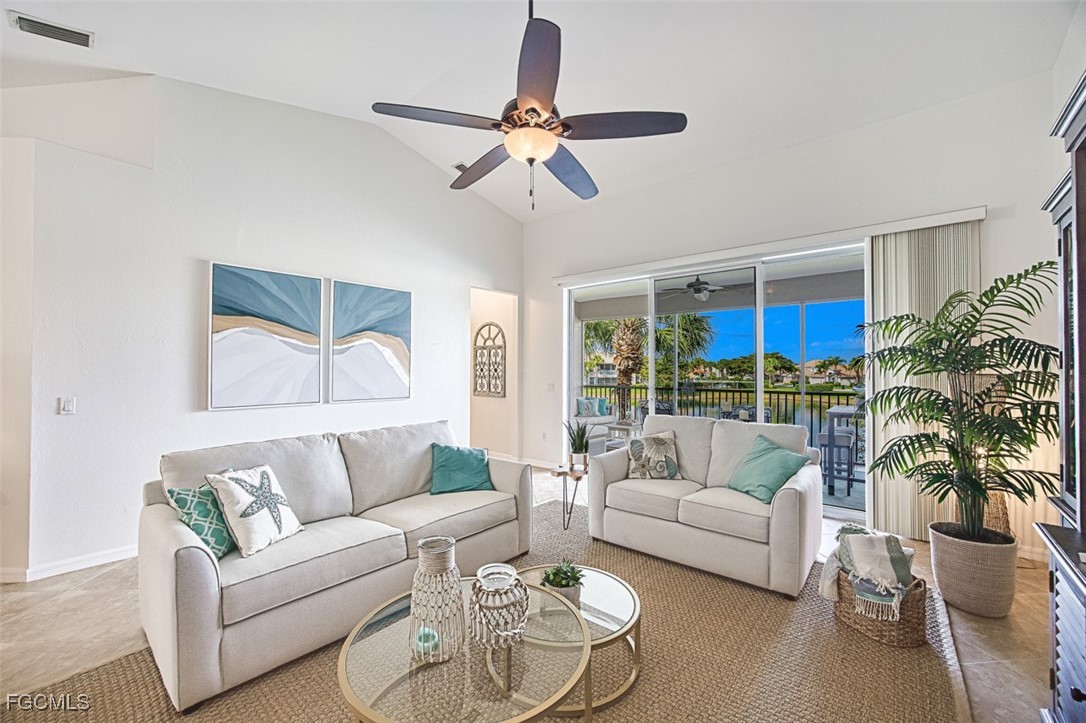 9570 Hemingway Lane, Unit 3205 Fort Myers, FL 33913 - Photo 15 of 43 a living room with furniture and a large window