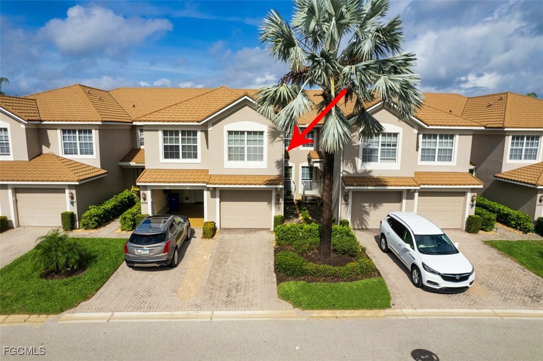 9570 Hemingway Lane, Unit 3205 Fort Myers, FL 33913 - Photo 2 of 43 a view of multiple houses with a yard and potted plants