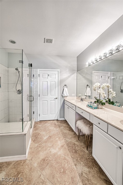 9570 Hemingway Lane, Unit 3205 Fort Myers, FL 33913 - Photo 21 of 43 a large bathroom with a large tub shower and sink