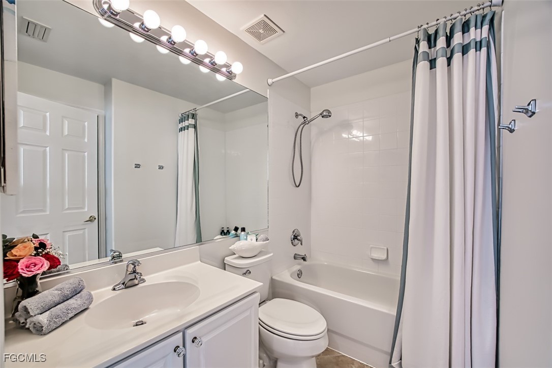 9570 Hemingway Lane, Unit 3205 Fort Myers, FL 33913 - Photo 25 of 43 a bathroom with a sink toilet tub and shower