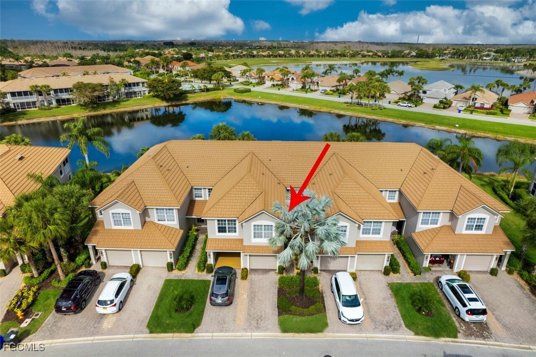 9570 Hemingway Lane, Unit 3205 Fort Myers, FL 33913 - Photo 4 of 43 an aerial view of residential houses with outdoor space and river