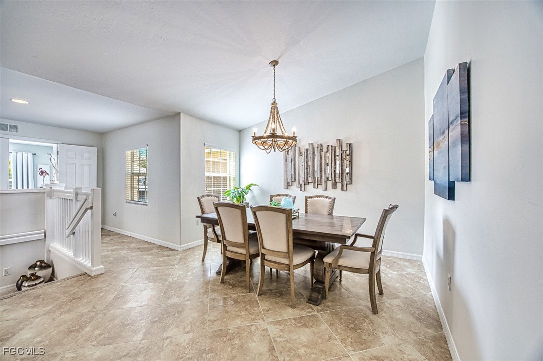 9570 Hemingway Lane, Unit 3205 Fort Myers, FL 33913 - Photo 9 of 43 a dining room with furniture and window