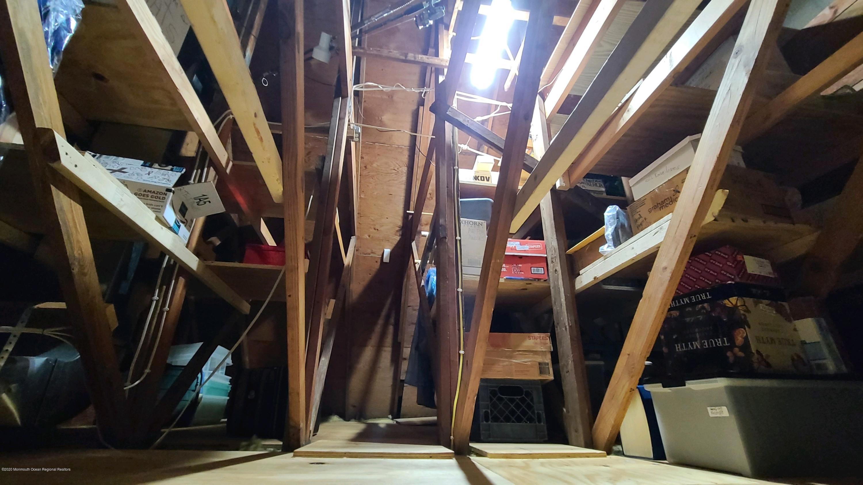 45 Wyckham Road Spring Lake Heights, NJ 07762 - Photo 21 of 23 lots of shelves in attic