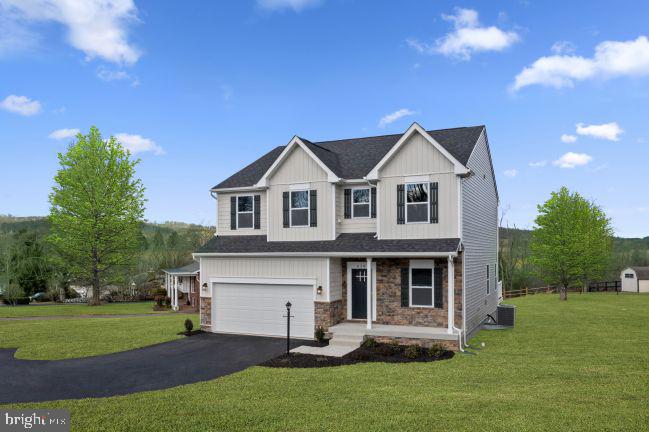 2 Regent Circle Hagerstown, MD 21742 - Photo 1 of 18 a front view of a house with a yard and trees