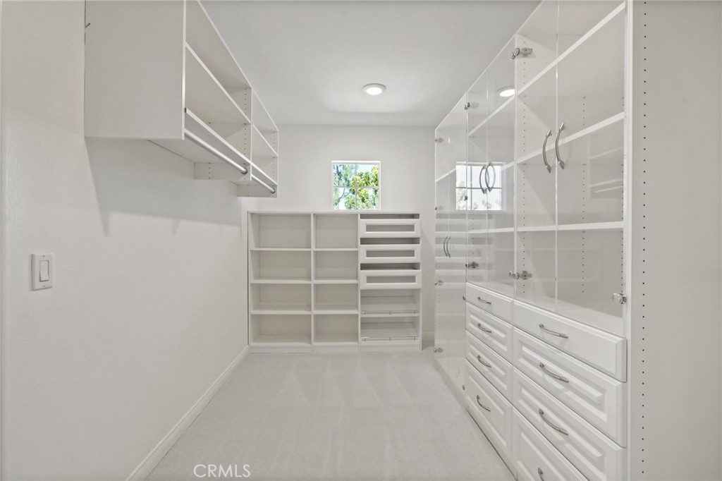 28 Rosenblum Irvine, CA 92602 - Photo 18 of 30 a view of walk in closet with empty racks