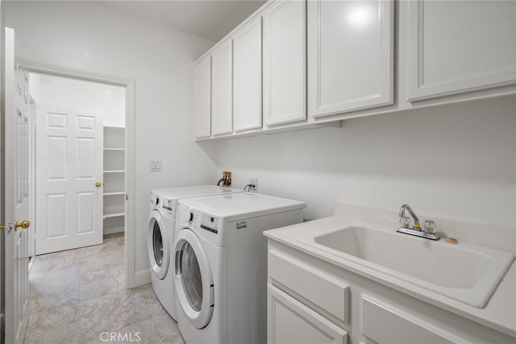 28 Rosenblum Irvine, CA 92602 - Photo 30 of 30 a utility room with dryer and washer