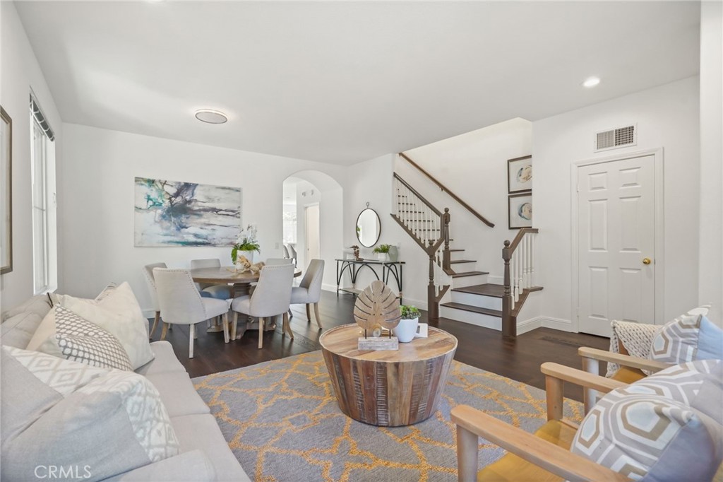 28 Rosenblum Irvine, CA 92602 - Photo 3 of 30 a living room with furniture and wooden floor
