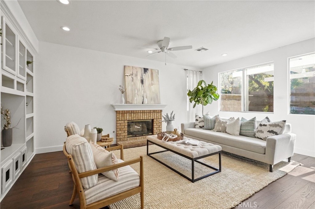 28 Rosenblum Irvine, CA 92602 - Photo 7 of 30 a living room with furniture fireplace and a large window