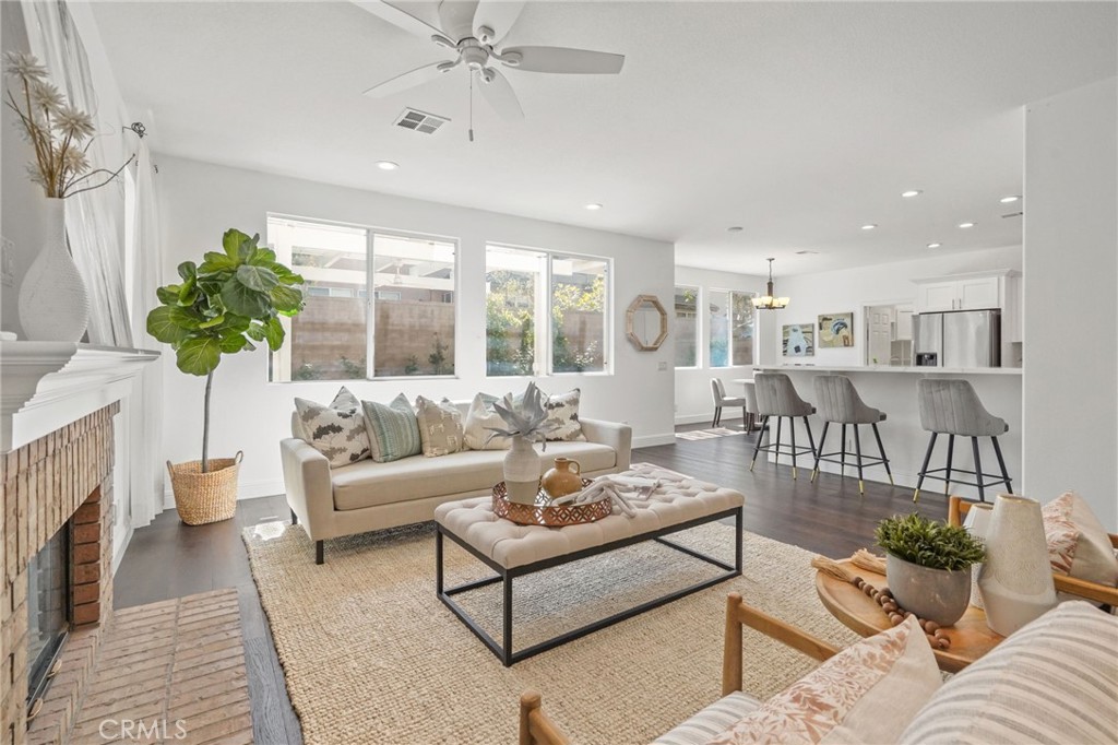 28 Rosenblum Irvine, CA 92602 - Photo 8 of 30 a living room with furniture and a fireplace