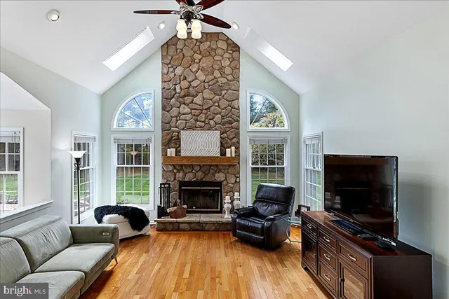 a living room with furniture fireplace and flat screen tv