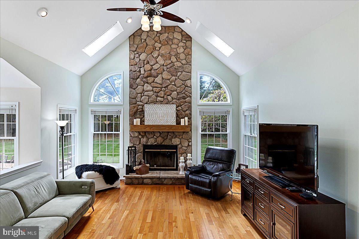 4 Banff Drive Princeton Junction, NJ 08550 - Photo 16 of 46 a living room with furniture fireplace and flat screen tv