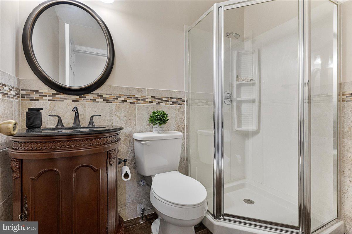 4 Banff Drive Princeton Junction, NJ 08550 - Photo 19 of 46 a bathroom with a toilet a sink and a mirror