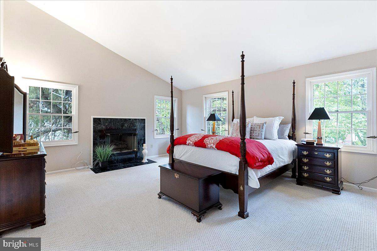 4 Banff Drive Princeton Junction, NJ 08550 - Photo 22 of 46 a spacious bedroom with a bed and a fireplace