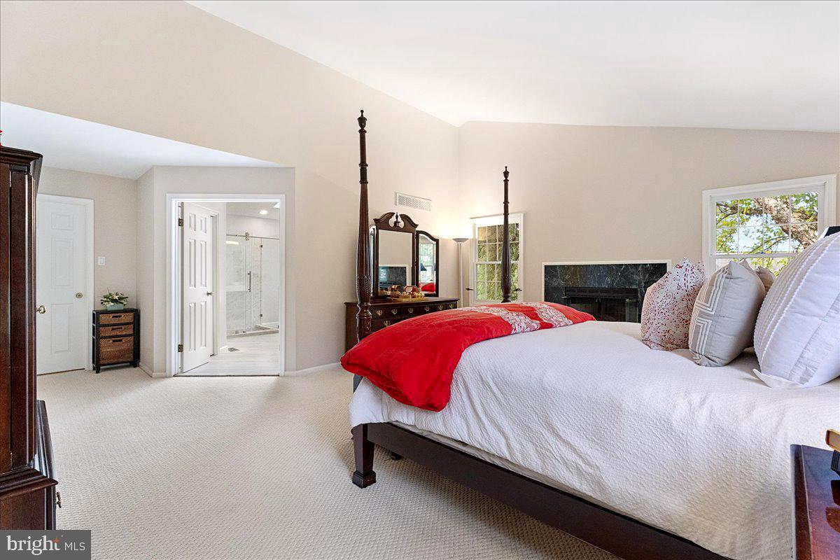 4 Banff Drive Princeton Junction, NJ 08550 - Photo 23 of 46 a bedroom with a large bed and a chandelier