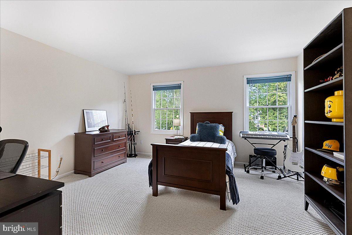 4 Banff Drive Princeton Junction, NJ 08550 - Photo 29 of 46 a living room with furniture a window and a flat screen tv