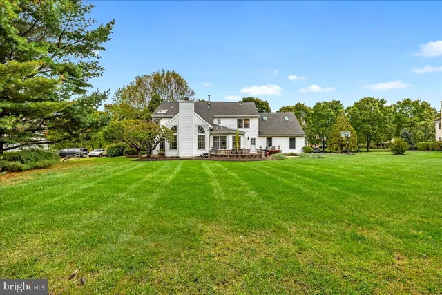 a front view of house with yard and outdoor seating