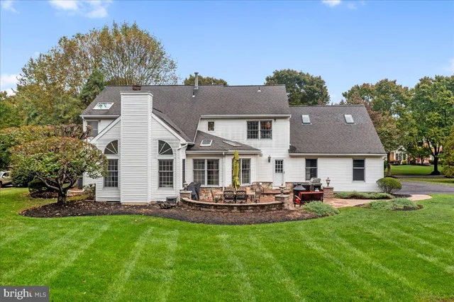 an aerial view of a house with a lake view