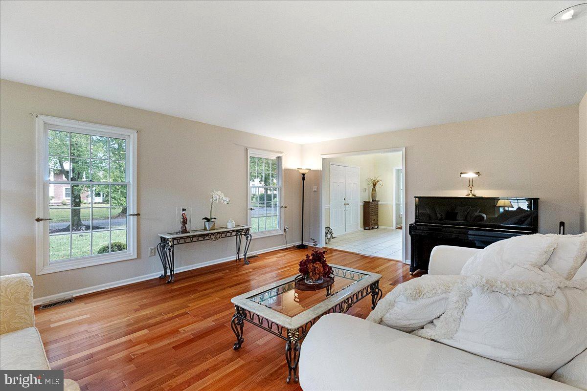 4 Banff Drive Princeton Junction, NJ 08550 - Photo 7 of 46 a living room with furniture and a wooden floor