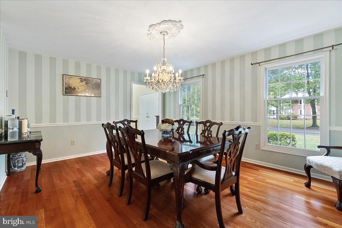 4 Banff Drive Princeton Junction, NJ 08550 - Photo 9 of 46 a dining room with furniture a large window and wooden floor