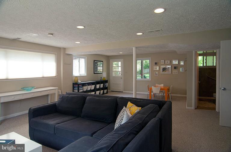 6503 Stoneham Road Bethesda, MD 20817 - Photo 15 of 24 Family Room with play area and door to backyard
