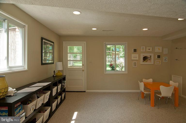 6503 Stoneham Road Bethesda, MD 20817 - Photo 19 of 24 Family Room play area and door out