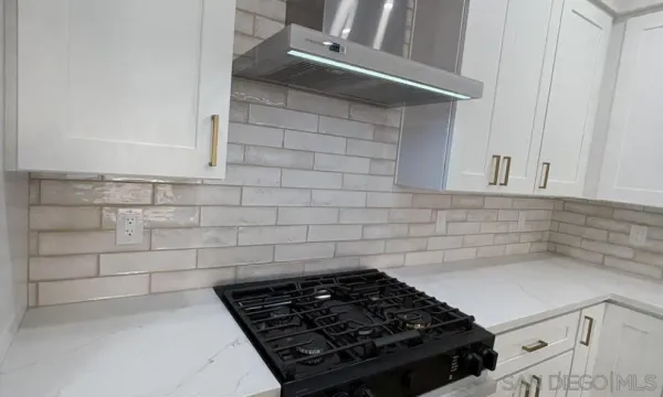 a view with cabinets a sink and dishwasher