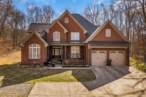 a front view of a house with yard