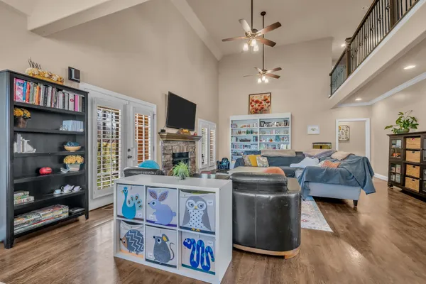 a living room with fireplace furniture and a flat screen tv