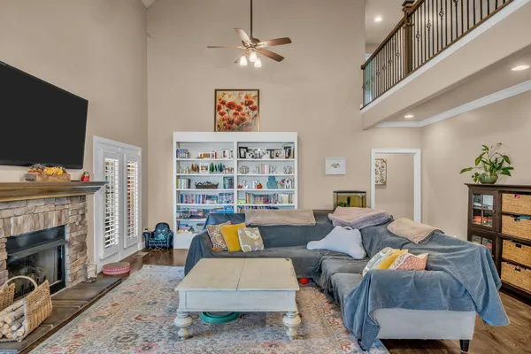 a living room with furniture and a fireplace