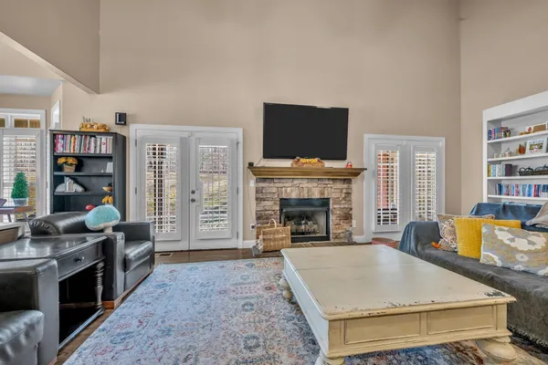 a living room with furniture fireplace and a flat screen tv