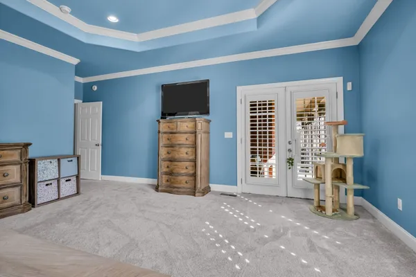 a bathroom with a granite countertop sink a mirror and a shower