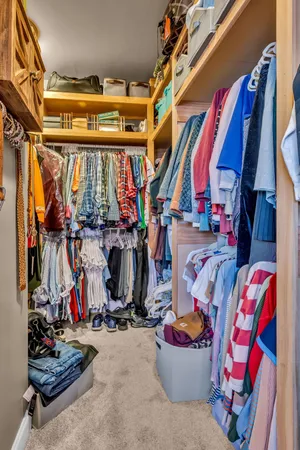 a bedroom with two beds and a window