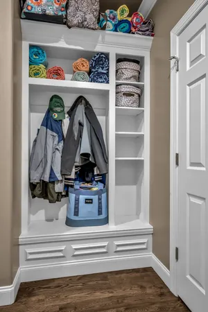 a view of an entryway with wooden floor and windows