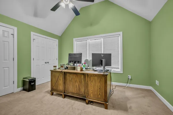 a bedroom with a workspace