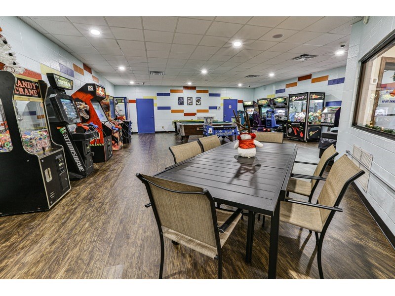 160 Primrose Court Ellijay, GA 30540 - Photo 41 of 52 a living room with lots of furniture and a flat screen tv