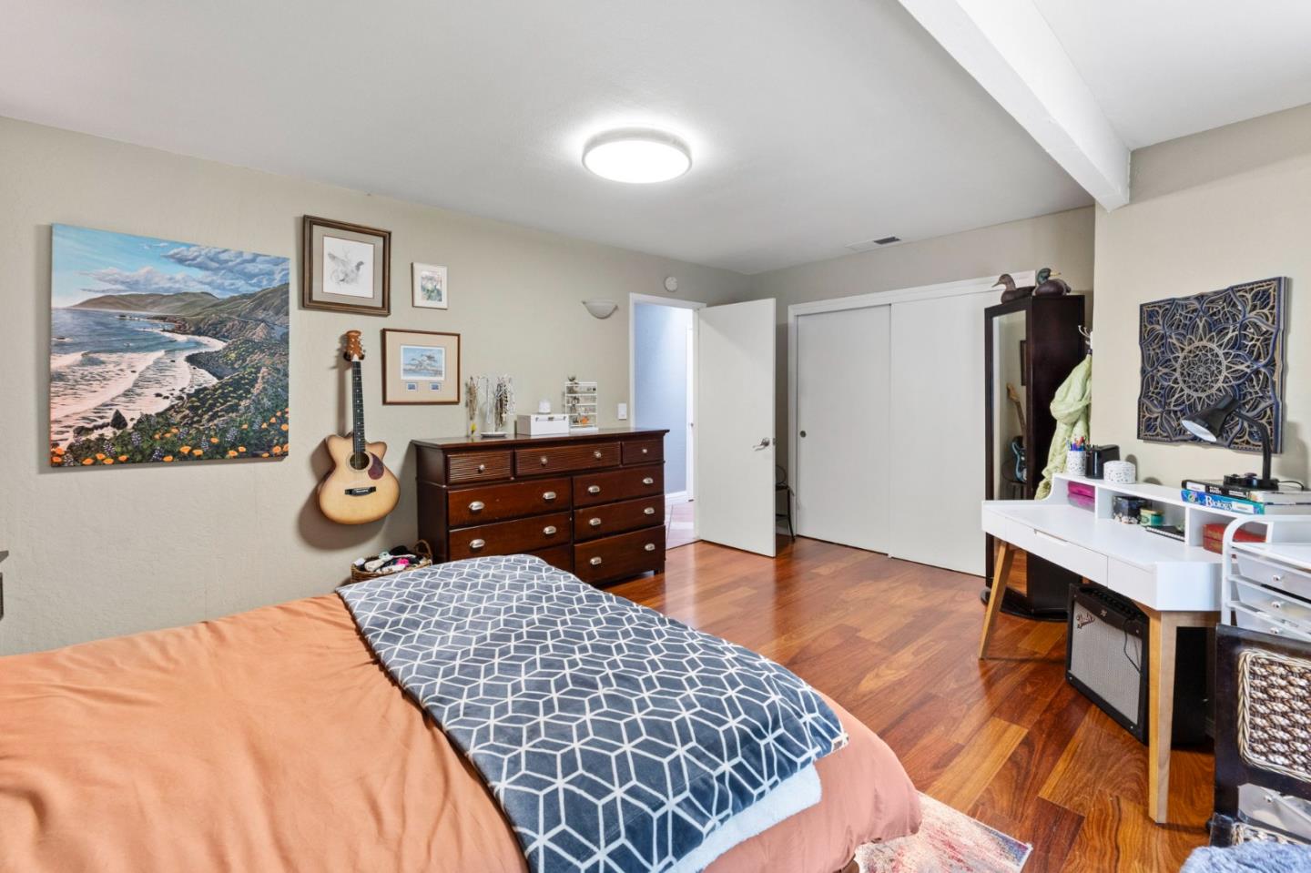 Undisclosed Address Santa Cruz, CA 95060 - Photo 16 of 35 a bedroom with a bed and wooden floor