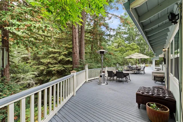 a view of balcony with wooden floor and outdoor seating
