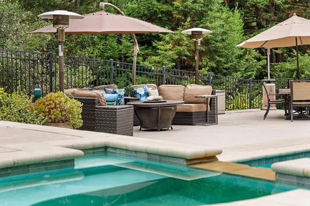 a view of backyard with seating area and green space