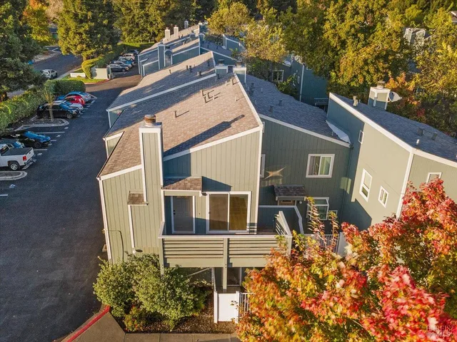 a front view of a house with plants