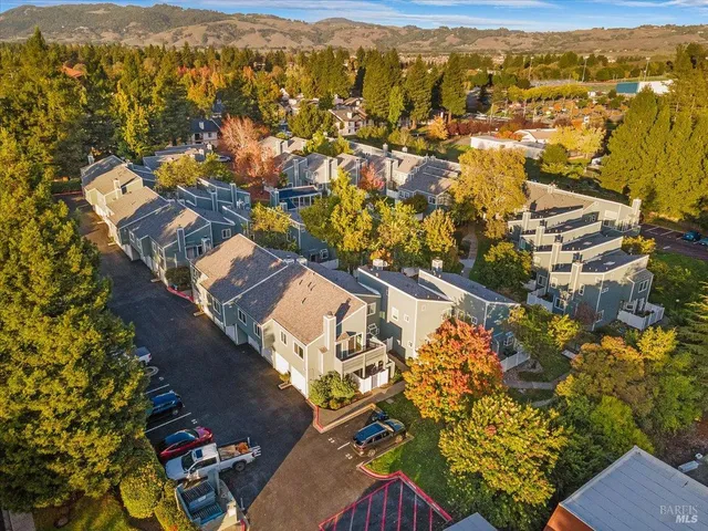 an aerial view of residential houses with outdoor space