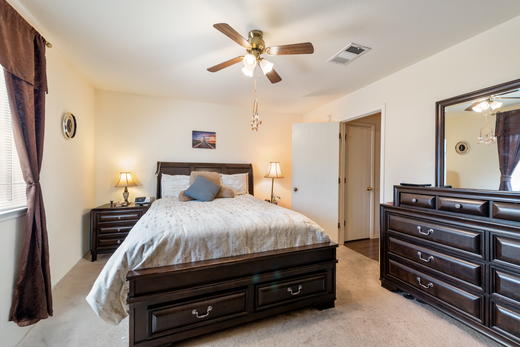 5501 English Avenue Austin, TX 78724 - Photo 5 of 19 a bedroom with a bed and a chandelier