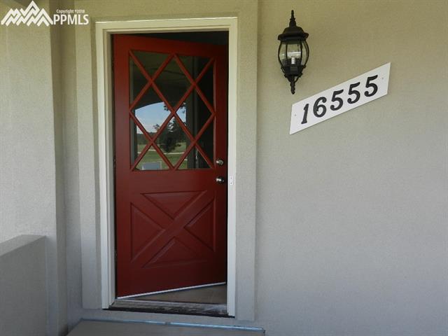 16555 Bar X Road Colorado Springs, CO 80908 - Photo 6 of 36 Welcome home. Come on in.