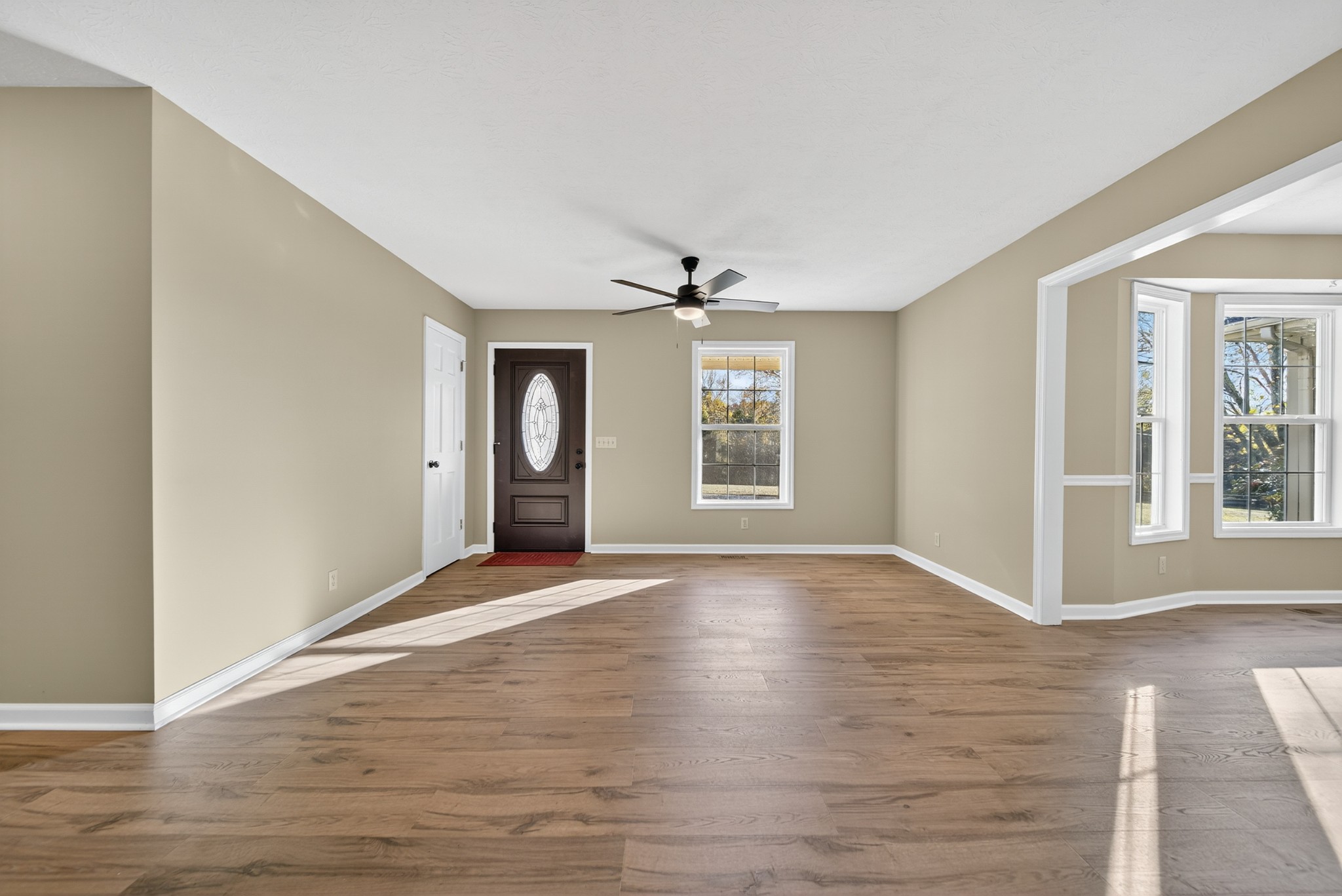 226 West Biggs Road Cottontown, TN 37048 - Photo 25 of 56 a view of an empty room with wooden floor and a window