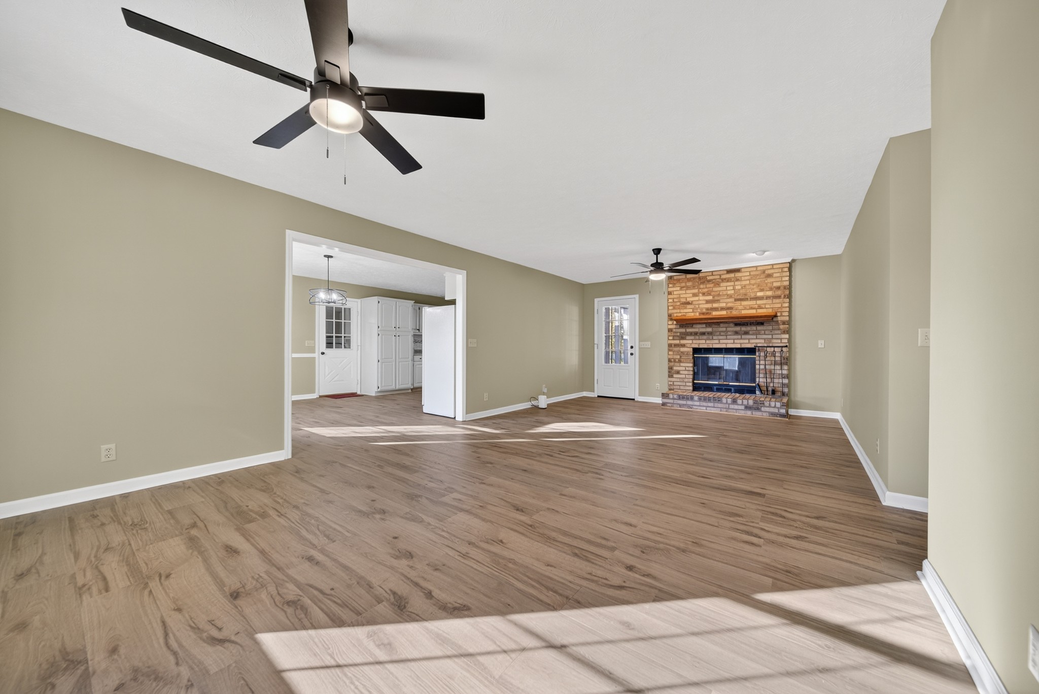 226 West Biggs Road Cottontown, TN 37048 - Photo 26 of 56 a view of empty room with wooden floor and fan